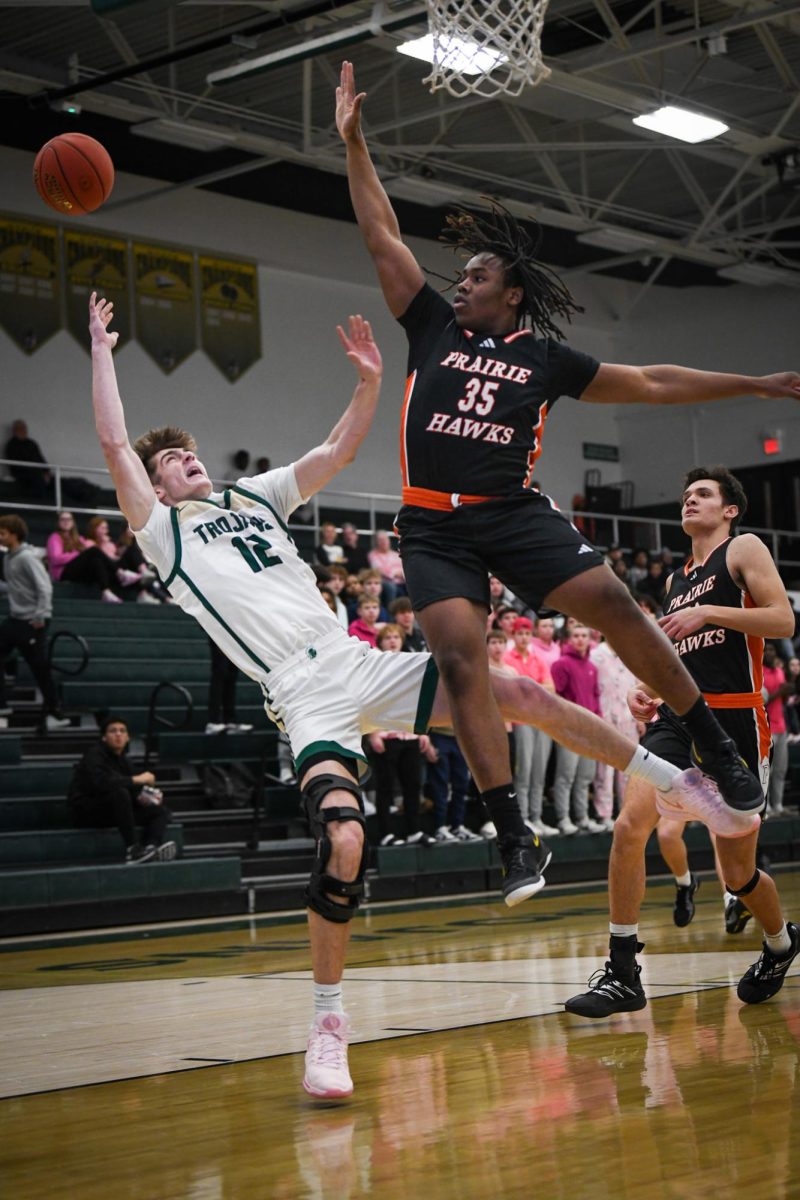 An opposing defender blocks Mason Goering '26 Jan. 17.