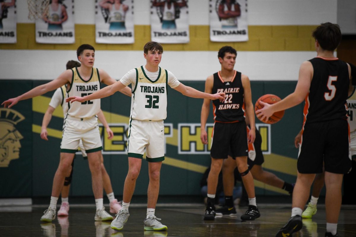 Spreading his arms, Henry Elser '26 prepares to defend against Prairie Jan. 17.