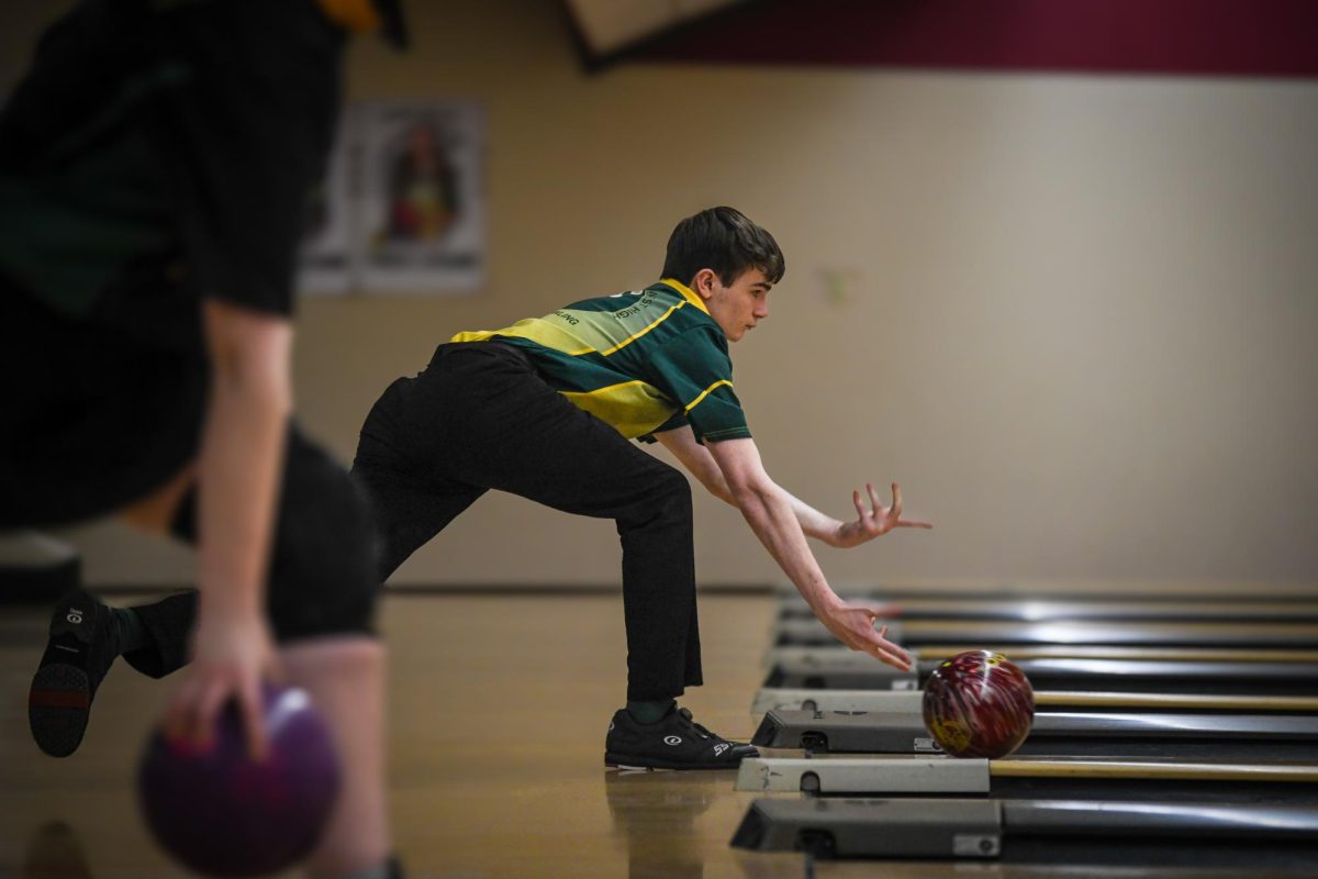 Releasing the ball, a Regina bowler goes for a strike Jan. 10 at Colonial Lanes