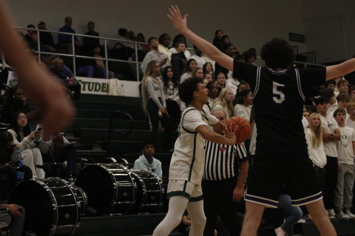 KingSton Swayzer '27 yells to his teammates before inbounding the ball. Swayzer scored 11 points and 1 assist. He ended the game strong by scoring one of the teams two three point shots of the night.