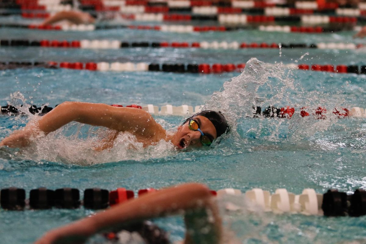 Nikolai Paulson '26 races in the 500-yard freestyle, clinching a time of 5:05.04.