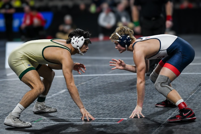 Justin Avila '25 prepares to take on his opponent. On Dec. 7, Avila took second in the 150lb weight class at Xtream Arena.