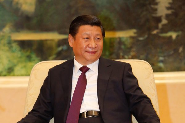 President Xi Jinping of the People's Republic of China smiles as he speaks to the public.