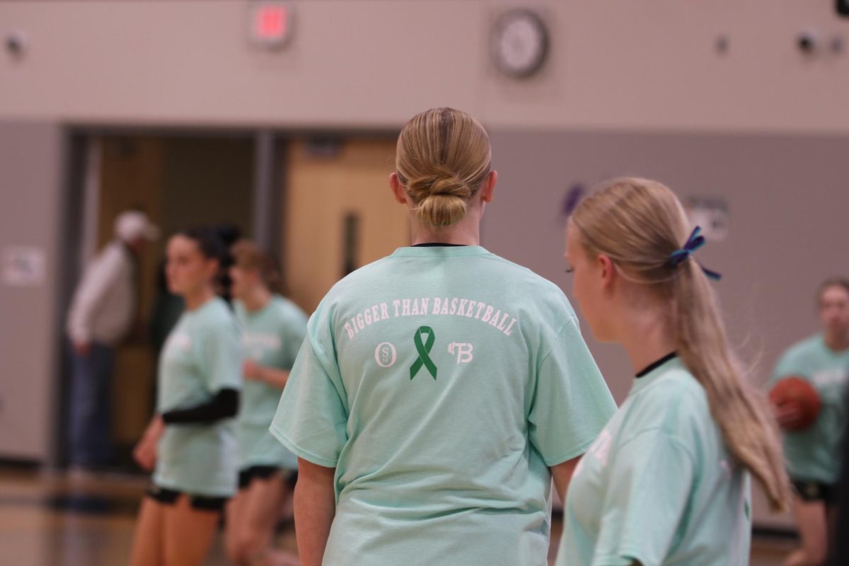 Known as "Mental Health Awareness Night," the West High and Liberty basketball teams showed their support by wearing "OS14" shirts that read "Bigger than Basketball" to honor Owen Skelley, a beloved student who died by suicide three years ago.