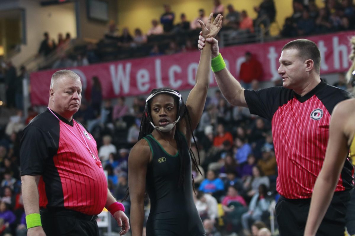 Trinity Myers '25 wins her second match of the girls state wrestling tournament on Feb. 6.