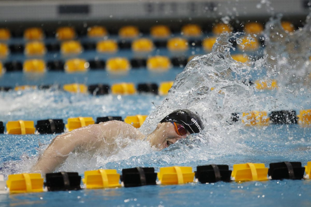 Gliding through the water, Hayden Hakes ‘25 swims the 200-freestyle Feb. 15 at the IHSAA State Swimming Meet.
