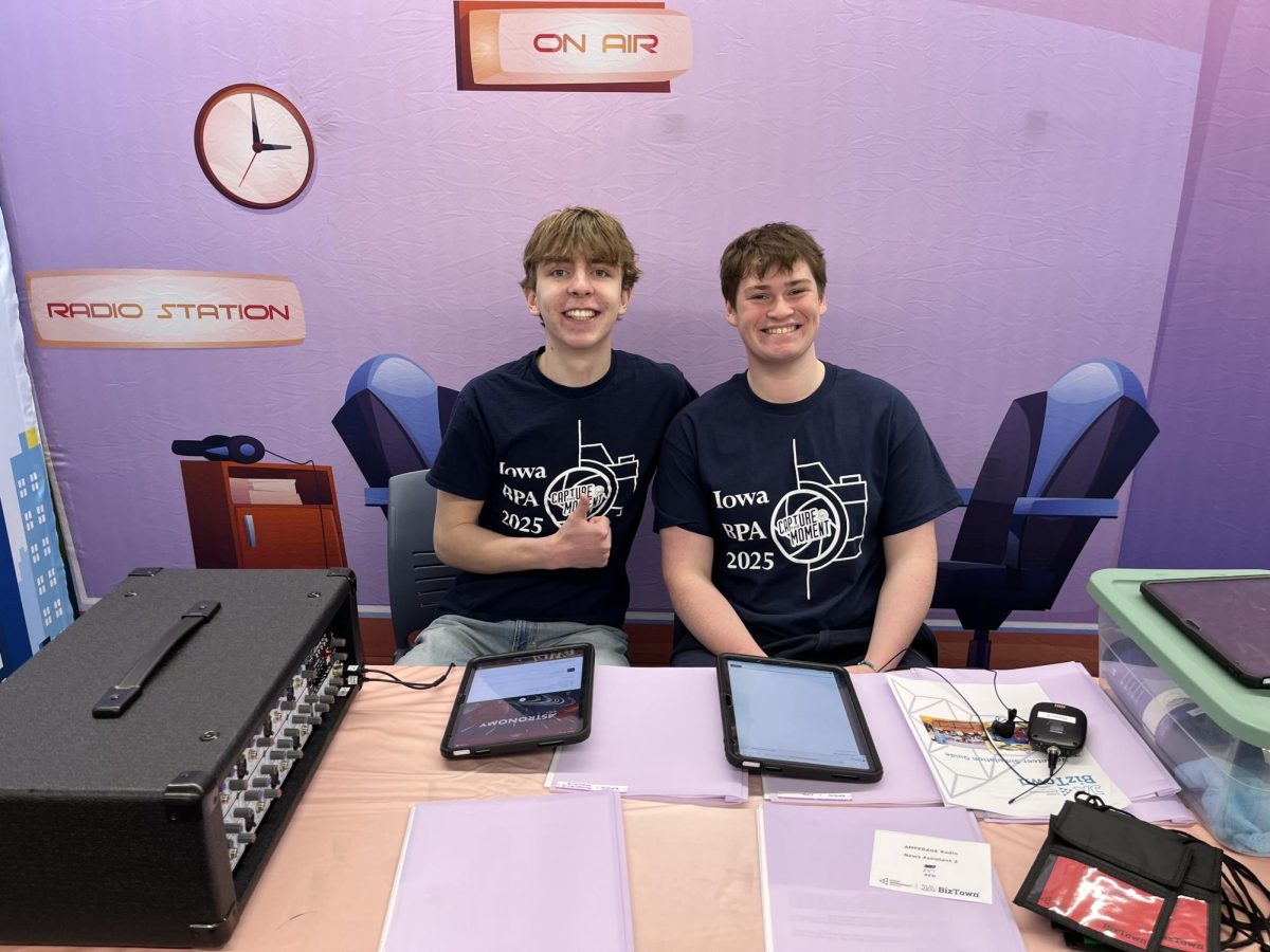 Seniors Jack Twait and Rowan Bihun pose at the radio station in the BizTown city.