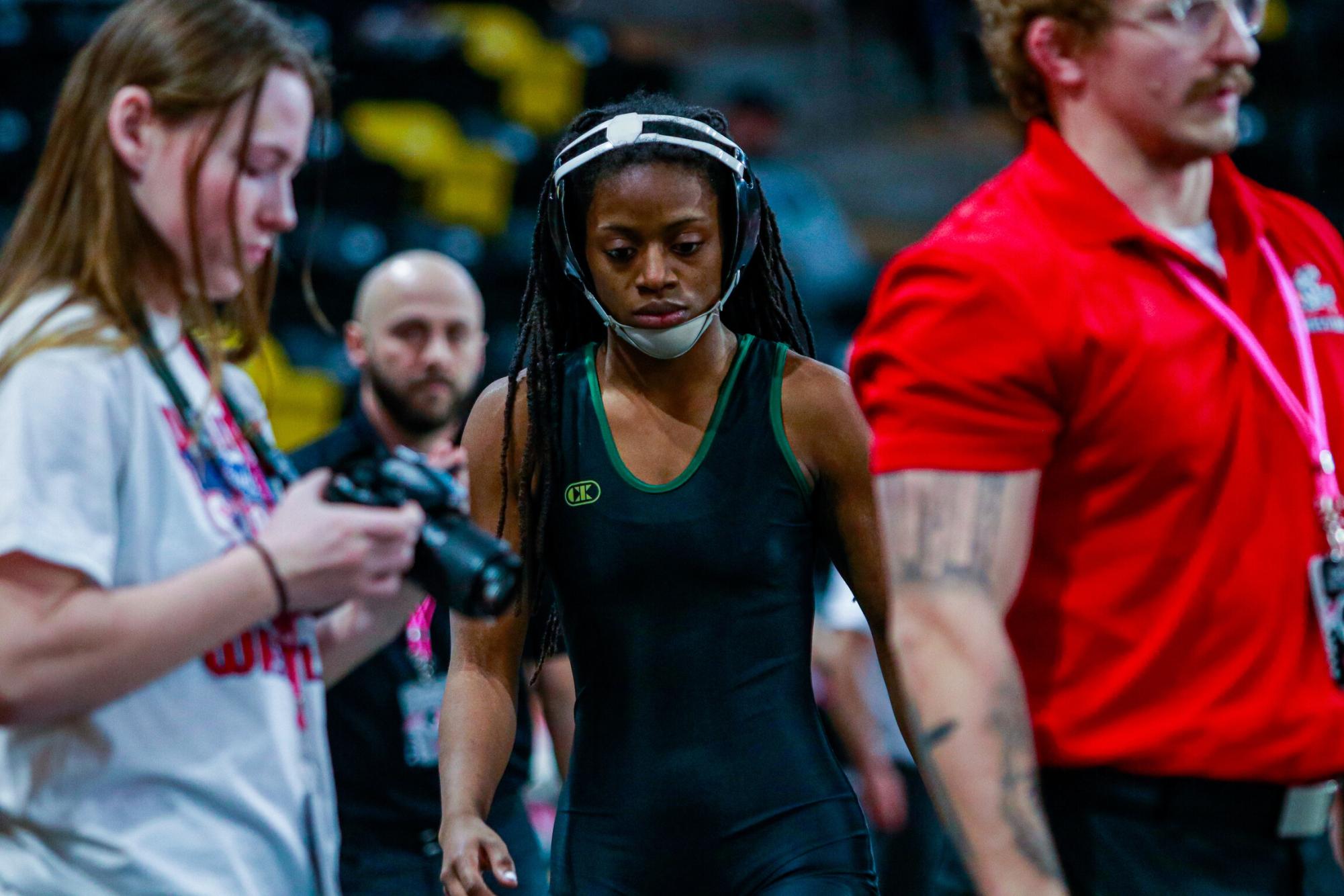 Trinity Myers ’25 walks to the mat, preparing to wrestle her final match at the state tournament on Feb. 6.