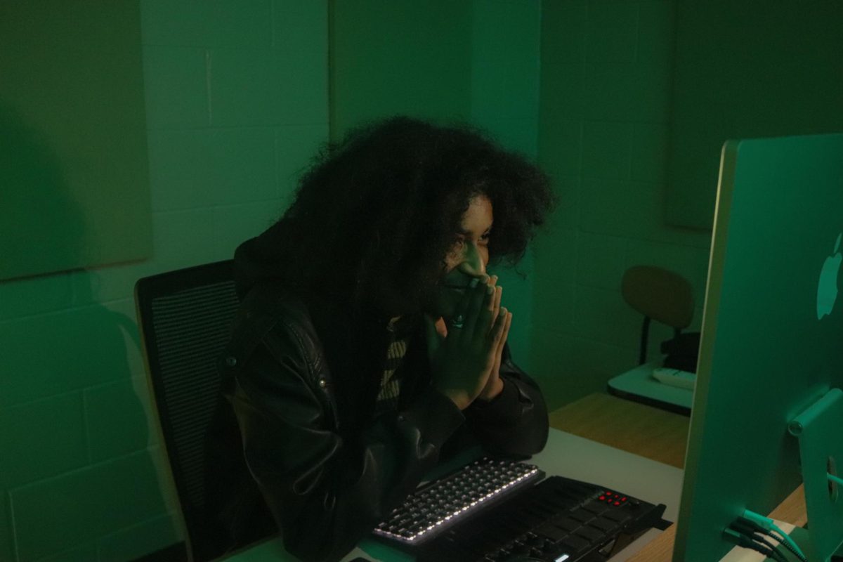 WSS Online Photo and News Editor Lea Abou Alaiwa '27 won best Feature Photo for this photo of Adel Osman ‘25 looking at a clip of music he made in the Digital Music Production room.