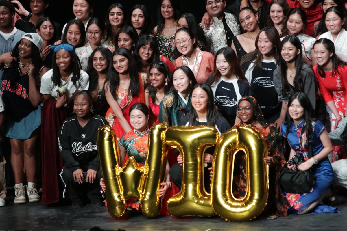 Walk it out members gather on the stage to pose for a large group photo. 