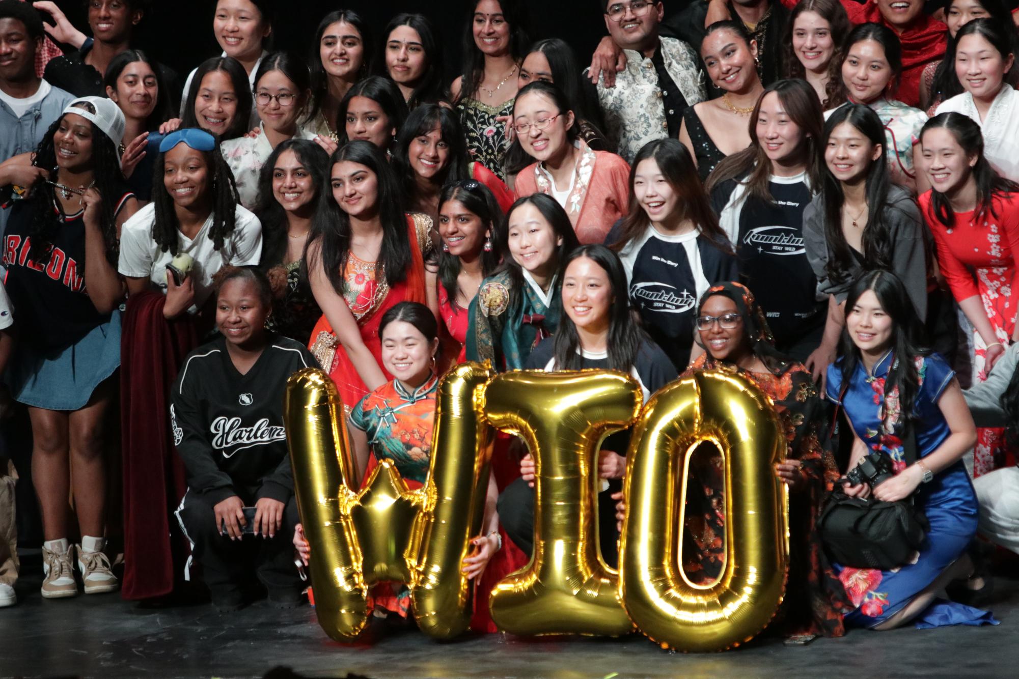 Walk it out members gather on the stage to pose for a large group photo. 