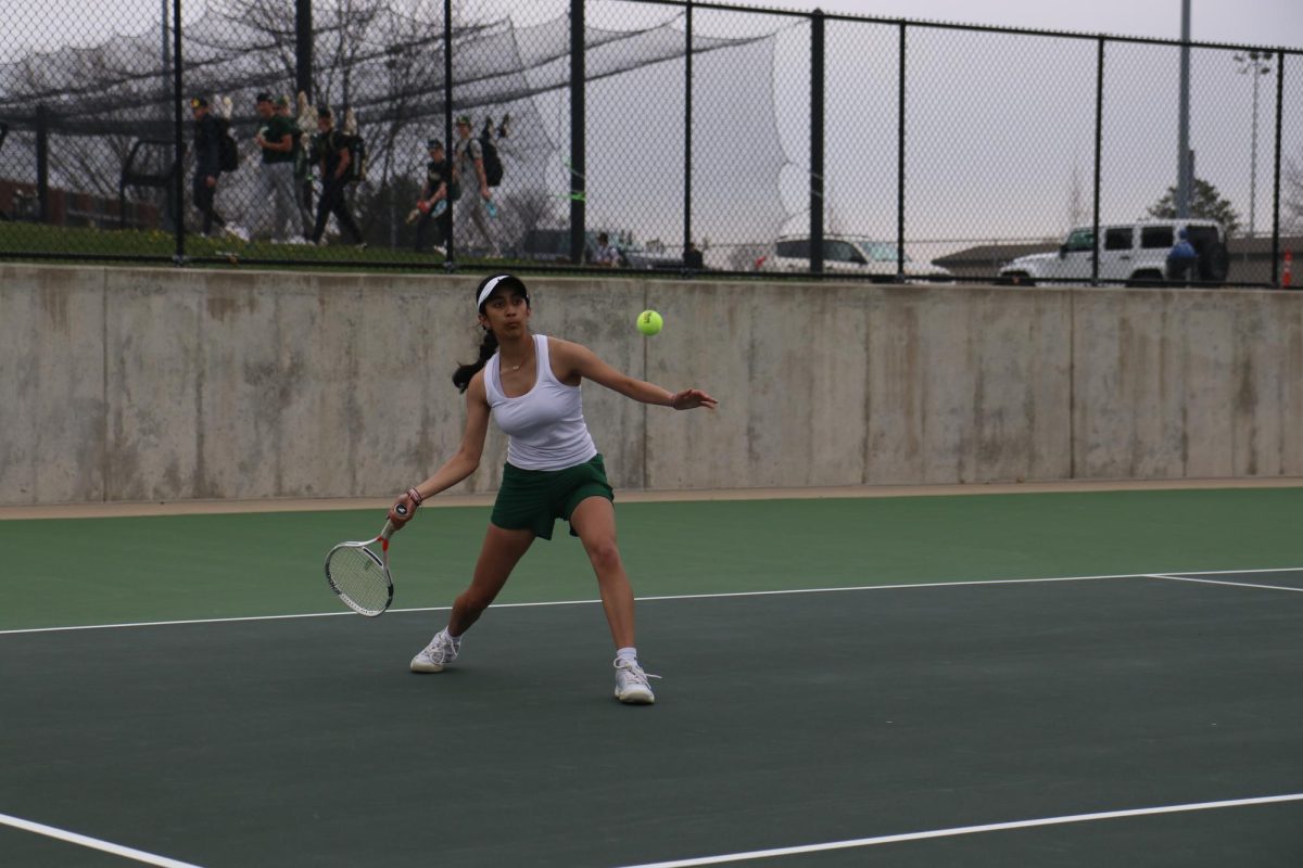 Sophie Singh '27 prepares to hit a forehand in her singles match against Prairie April 17. Singh won her match 6-1, 6-0.