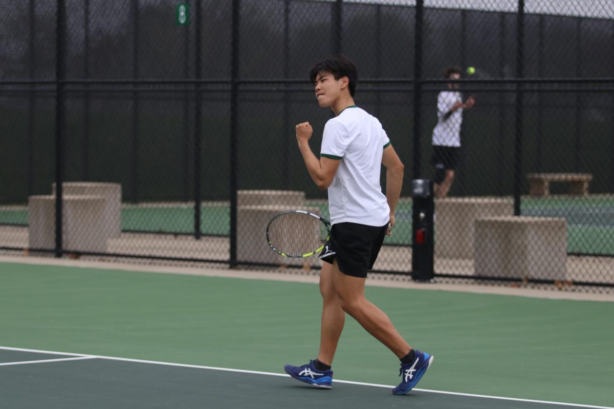 Derek Hua '25 celebrates a point against Dubuque Senior at the West High Courts April 18. 