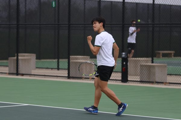 Derek Hua '25 celebrates a point against Dubuque Senior at the West High Courts April 18. 