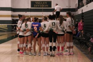 Iowa City West girls volleyball huddles up  before their game at the Live Like Line tournament.