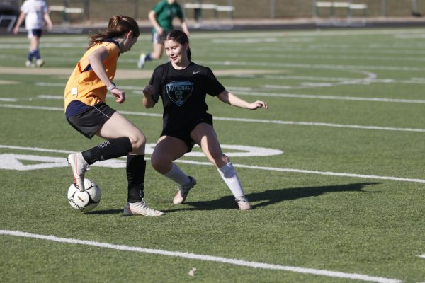 Paz Martinez '25 battles for the ball during spring break practices.
