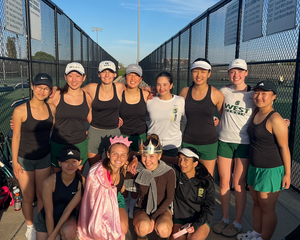 The girls tennis team smiles at their home courts after winning their match against Kennedy 9-0 on April 29. 

Photo Courtesy of Nina Marquardt