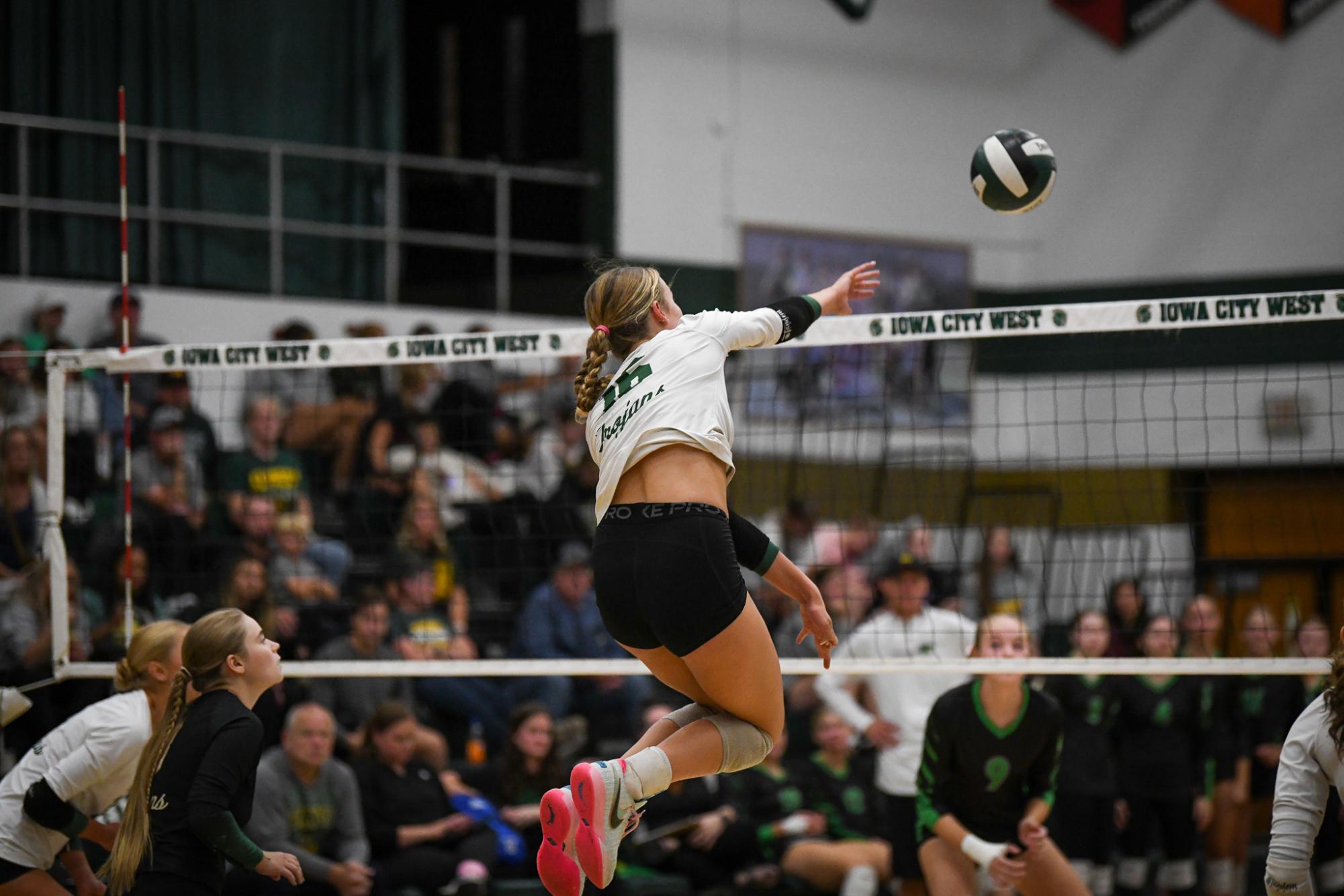 Going for a kill, Sophia Austen ’27 spikes the ball in the annual Battle for the Spike against City High at West High Oct. 3.