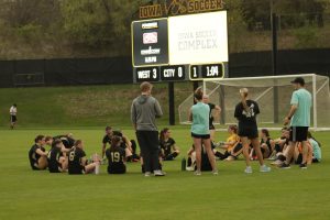 During halftime the girls sit together with their coaches to hear feedback and game plans.