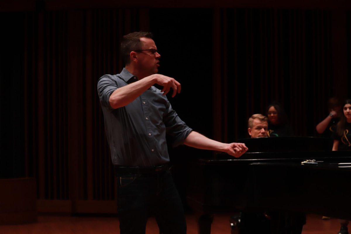Professor Michael MacGaghie teaches West Singers during their clinic at Macalester College in Minnesota. 