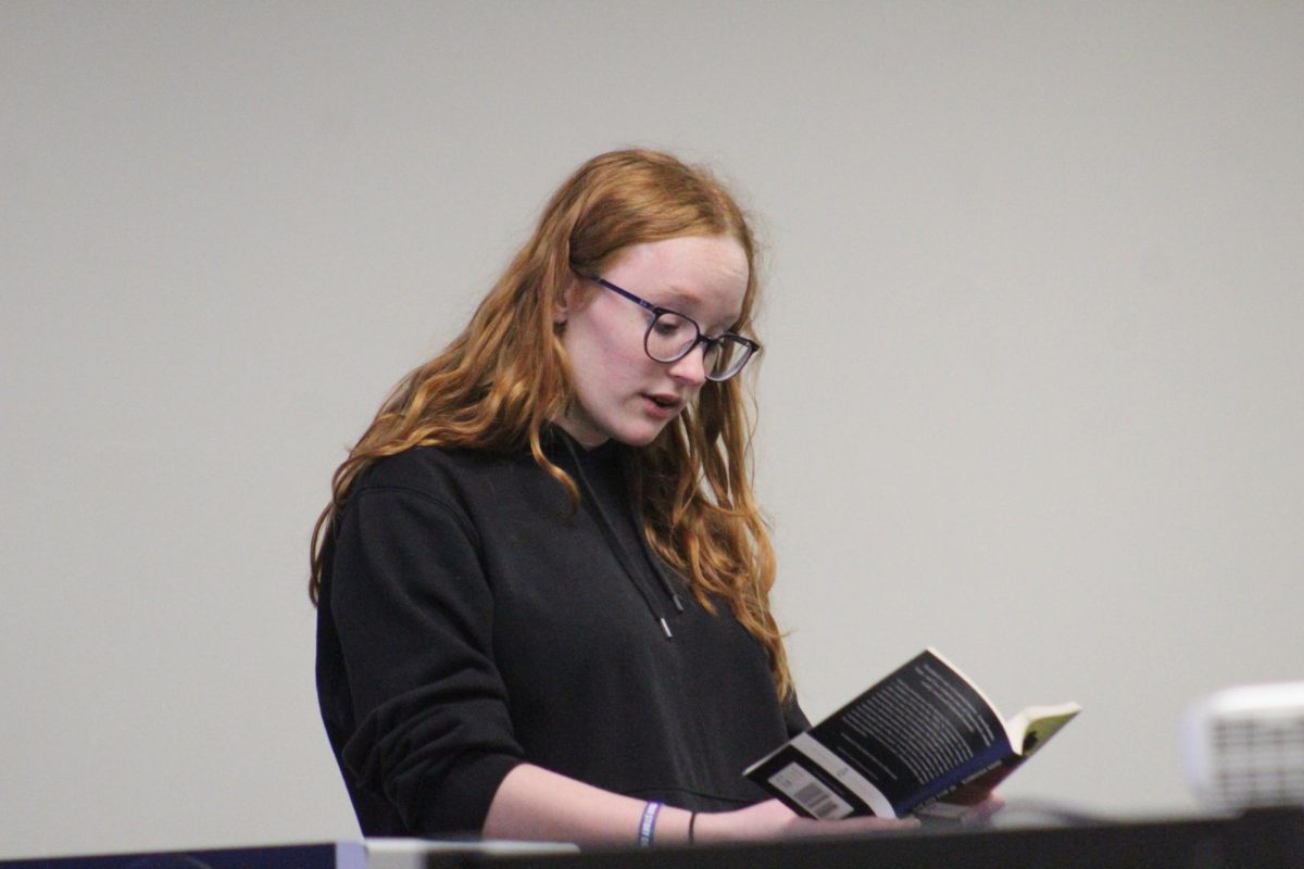 Kate Johnson '27 reads a passage from "Of Mice and Men" by John Steinbeck at the Banned Book Club Open Mic May 3. 