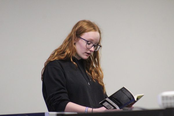 Kate Johnson '27 reads a passage from "Of Mice and Men" by John Steinbeck at the Banned Book Club Open Mic May 3. 