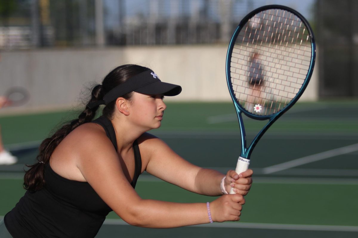 Iris Vasi '28 readies herself at the net during doubles against Linn-Mar May 8. 