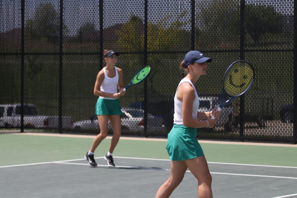 Seniors Sasha Postnikov and Marie Stier prepare to return a serve during the semi-final match. Postnikov and Stier won the match 6-0, 6-0. 