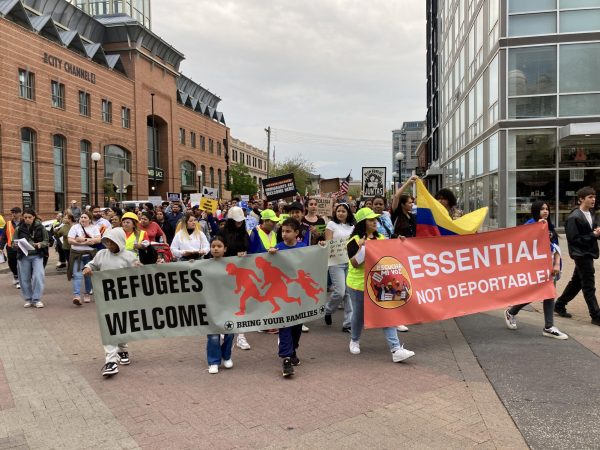Protesters held signs and chanted in Spanish during their march across the Iowa City downtown area. Their chants included “La poli, la migra, la misma porqueria,” translating to “The police, ICE, the same beast.”