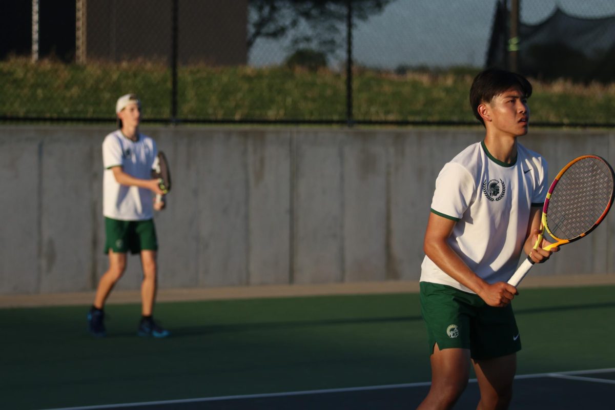 Pierce Hribar ’28 and Derek Hua ’25 prepare for the serve in their match against Cedar Rapids Washington May 6.