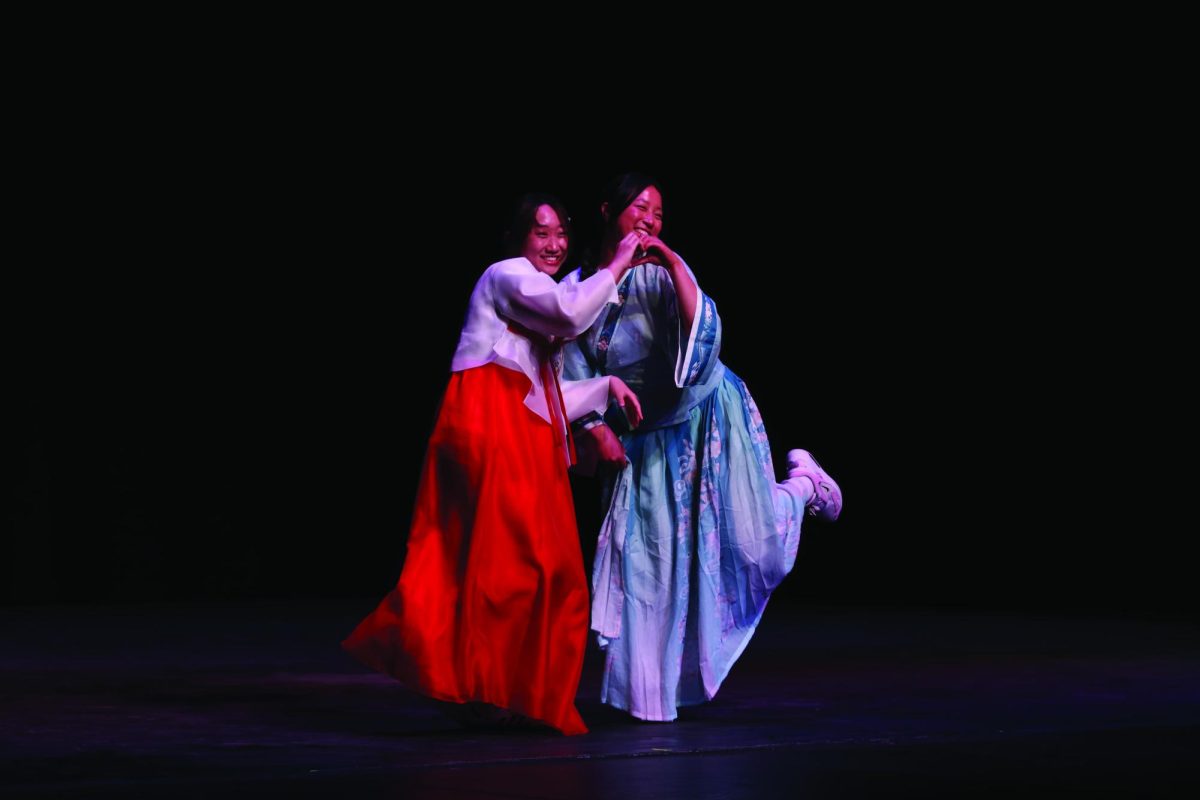 Claire Hahn '25 and Gianna Liu '25 pose after their performance.