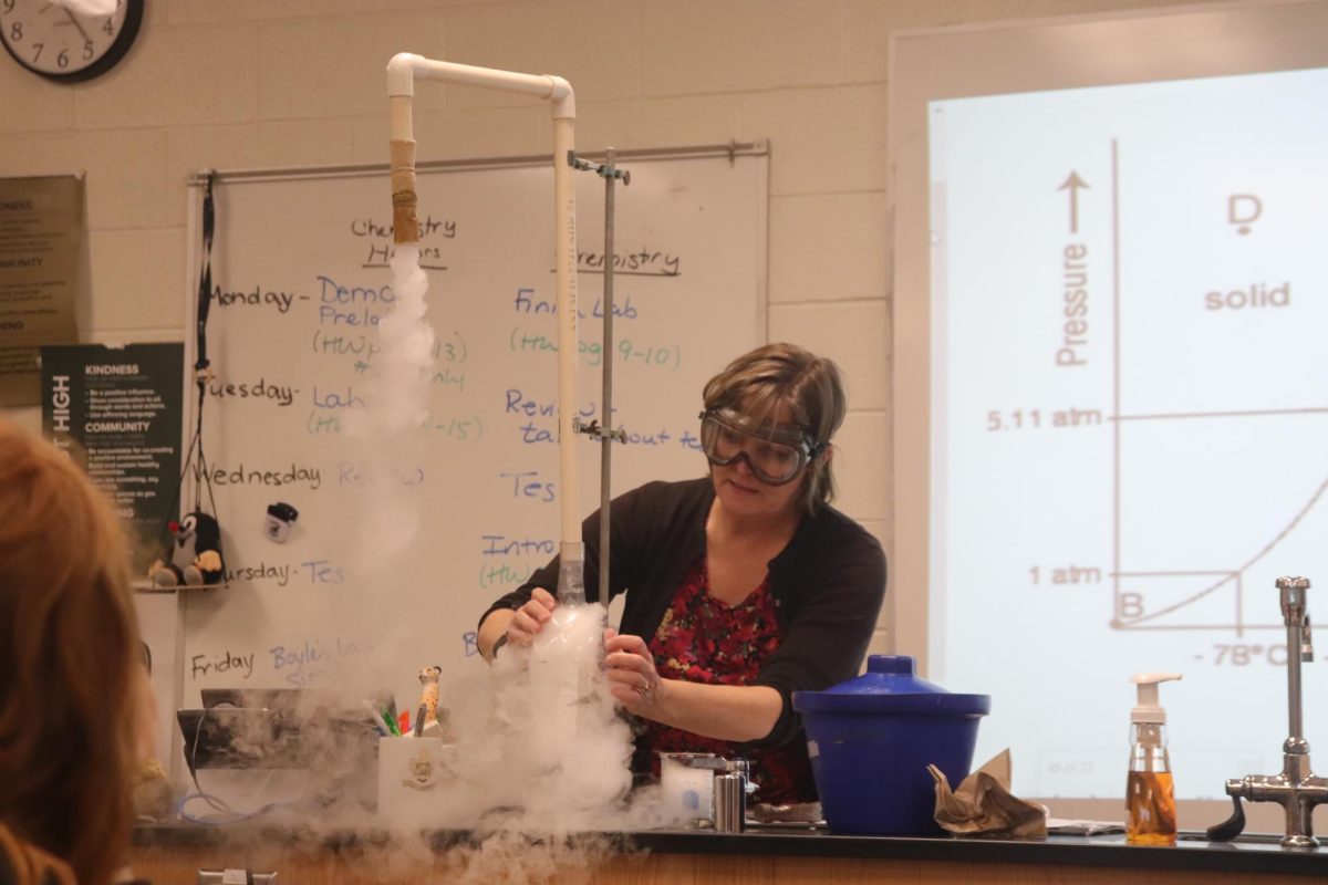 Carolyn Walling does a demonstration with dry ice for her class.