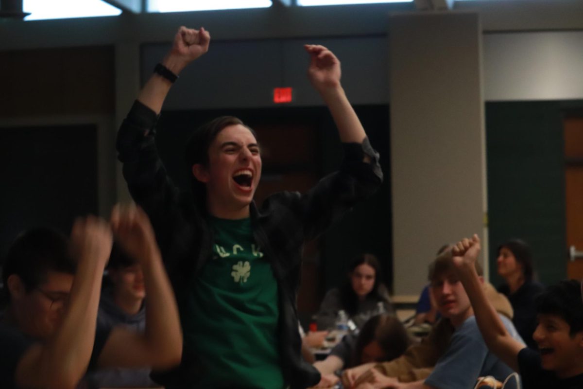 Alexander Moss '28 celebrates after the club announces that his team, WATER, won.