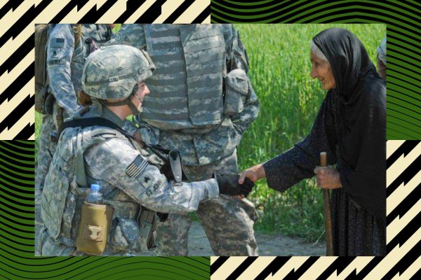 While stationed in Afghanistan, Jessie St. John shakes hands with a local.