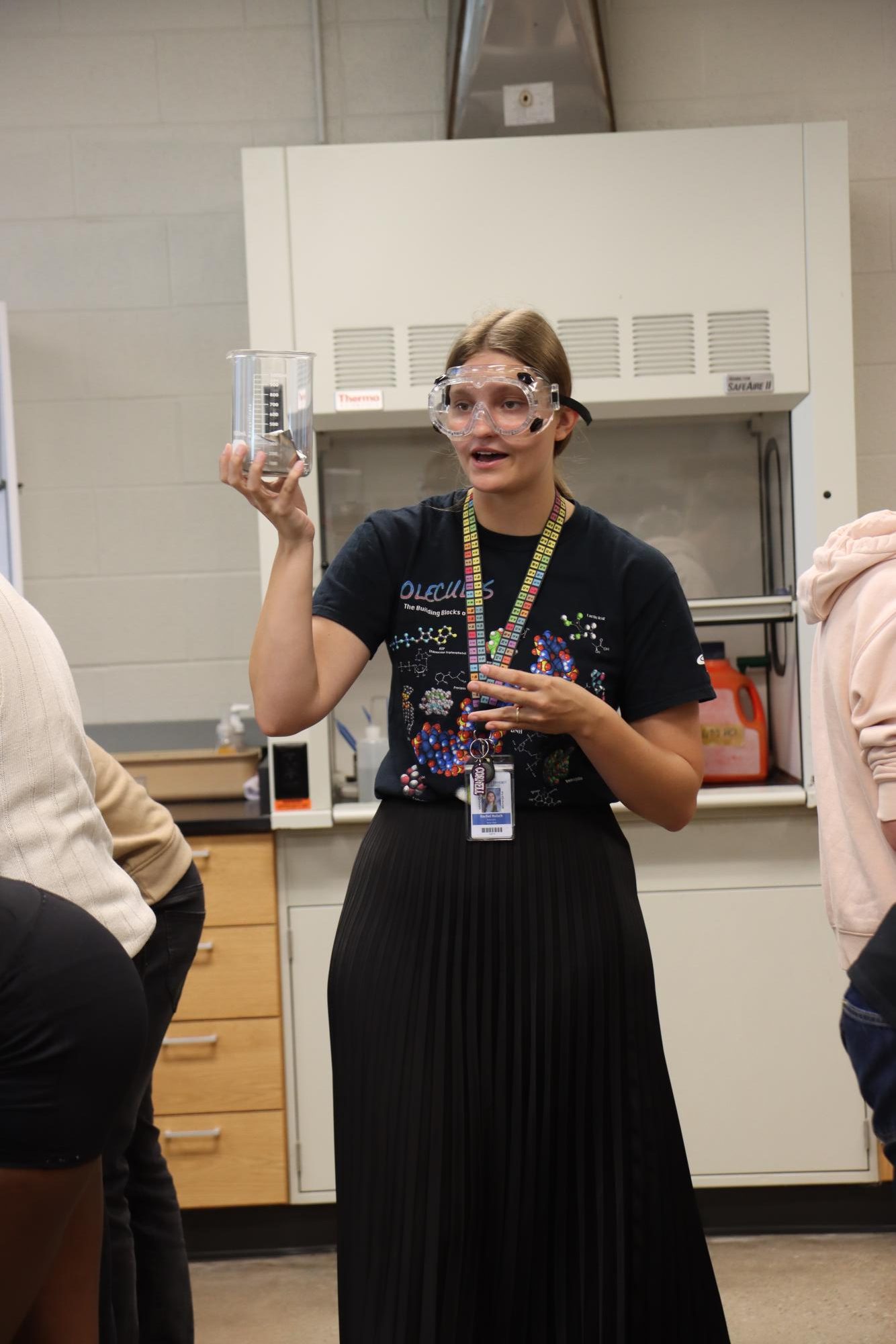 New science teacher Rachel Ruisch asks around the lab if students need tin foil for their XY lab Sept. 15.
