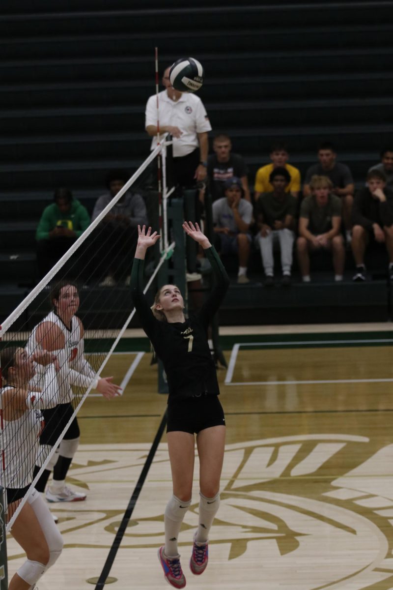 Setter Lila Eastvold '27 sets a hitter up.