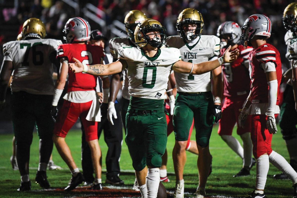 Campbell Janis ‘26 celebrates after a touchdown Aug. 29.