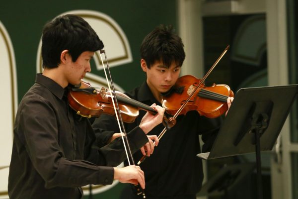 Jensen Lin '27 and Nathan Chen '28 play "Tambourin" by François Joseph Gossec.