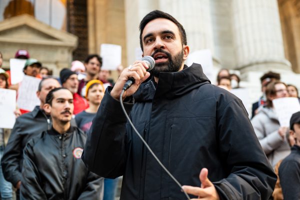 "Zohran Mamdani at the Resist Fascism Rally in Bryant Park on Oct 27, 2024" by Bingjiefu He is licensed under CC BY-SA 4.0. To view a copy of this license, visit https://creativecommons.org/licenses/by-sa/4.0/?ref=openverse.