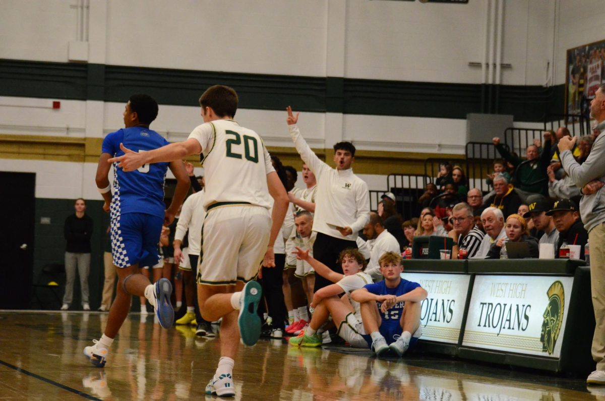 Jack Jensen-Fitzpatrick '26 celebrates after making a three pointer 