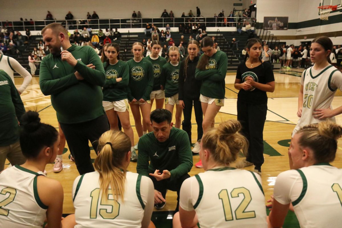 Coach Nate Freese talks to his players during a timeout break