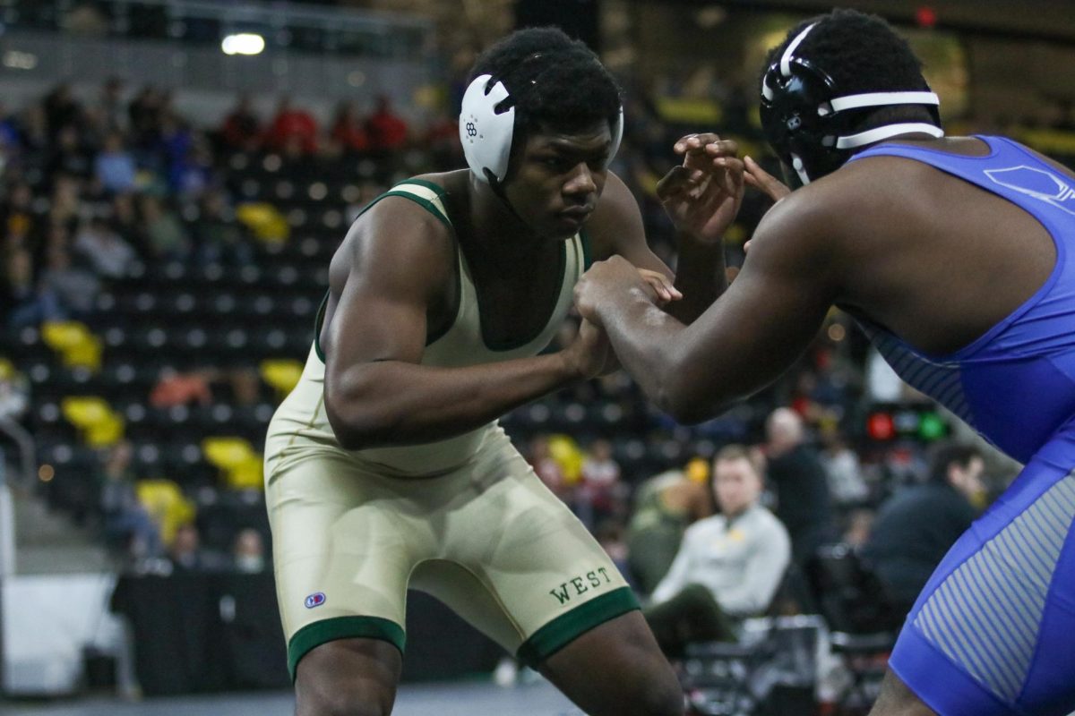Ashten Holmes '28 looks for an angle on his opponent Dec. 6.