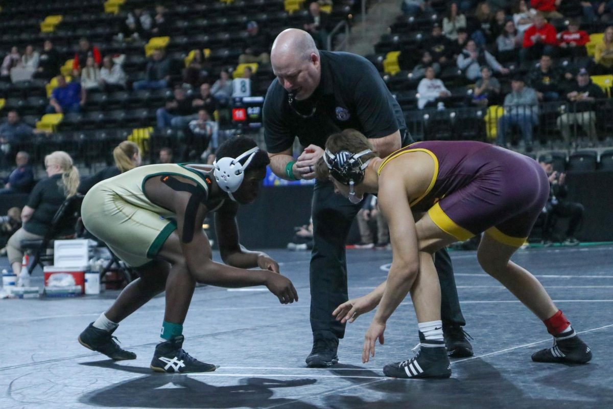 Mehdi Bangana '28 prepares to wrestle Dec. 6.
