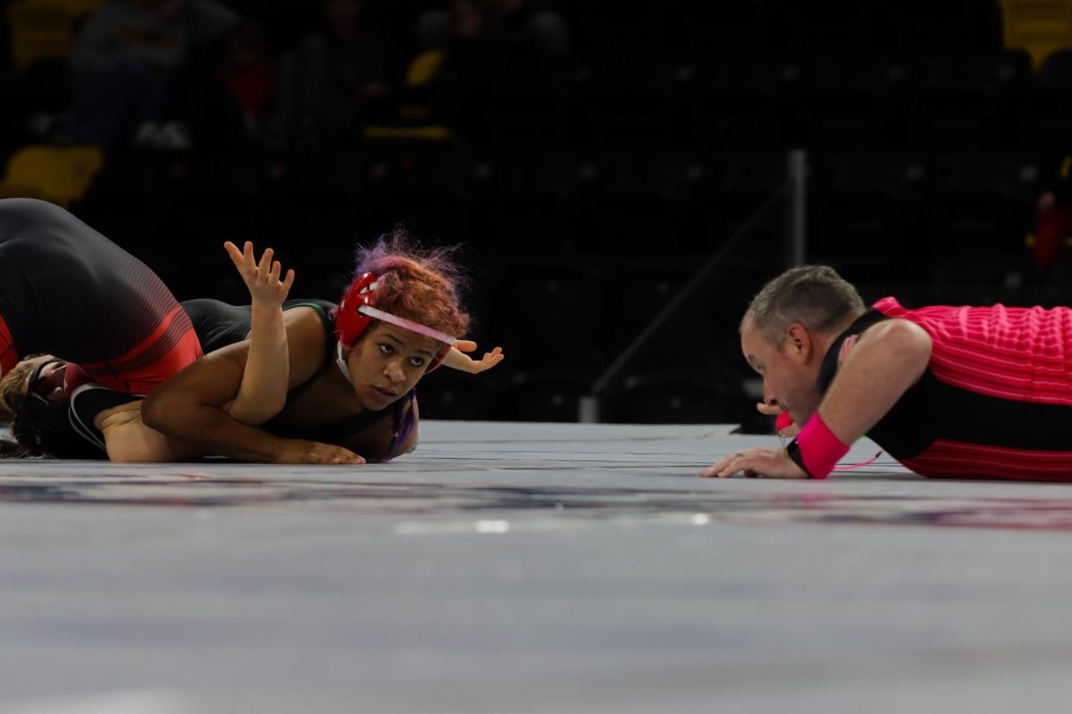 Looking up at the referee, Brianna Lucero ‘27 adds more pressure on opponent seconds before pinning her. After initially wrestling City High’s Amelia Terrill at the Dan Gable Donnybrook tournament two weeks ago and losing, Lucero took this chance to give it her all in the rematch.