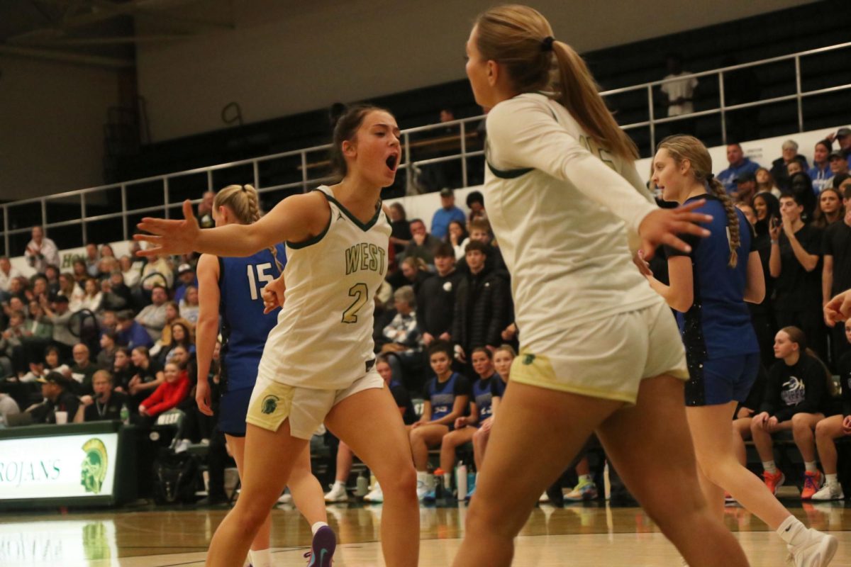 Ava Freese '26 celebrates with Lauryn Hynek '26 after a foul by CCA