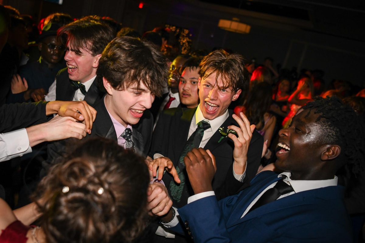 Laughing together, Miles Richardson ’27, Venelin Kotev ’26 and Derick Doresca ’26 celebrate prom at the Graduate Hotel May 3. West High students danced, ate and partied from 6:00 p.m. to 9:00 p.m.
