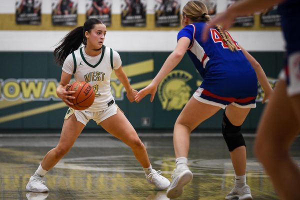 Dribbling the ball, Ava Frese '26 looks for a way around her opponent. Frese garnered three assists throughout the second half in the North Gym Jan. 3.