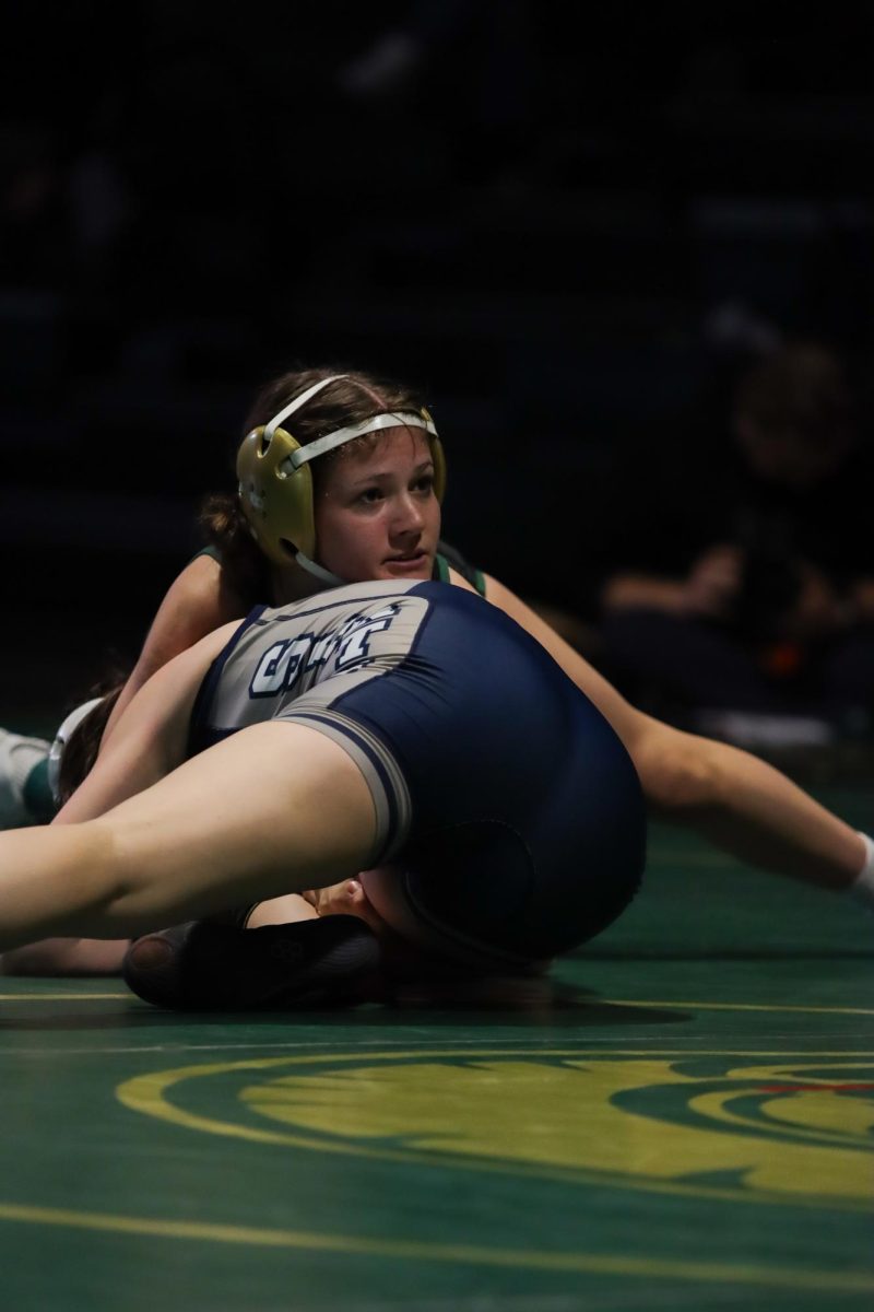Running what's known as a "butcher," Noah Overholt '28 tries to turn her opponent. Overholt ultimately won her match by fall in two minutes and 18 seconds.
