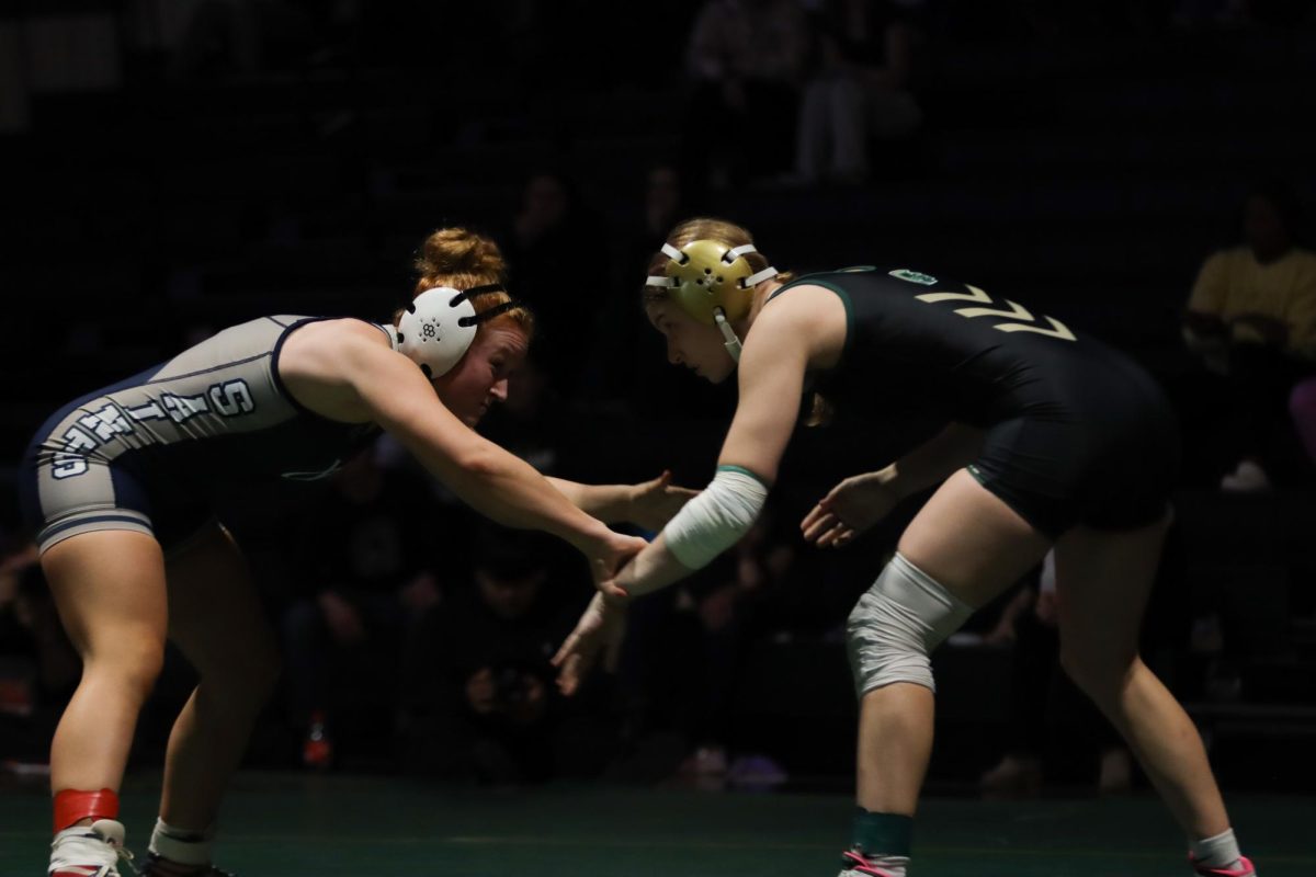 Sylvia Broffitt '26 looks for an opening in her match against Xavier Jan. 8. Broffitt was recently ranked 11th in class 2A at the state level by IAwrestle.