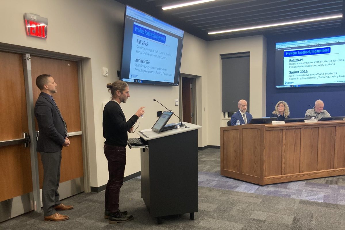 Brady Shutt, president of the Iowa City Education Association, delivers a presentation on the development of the current ICCSD phone policy.